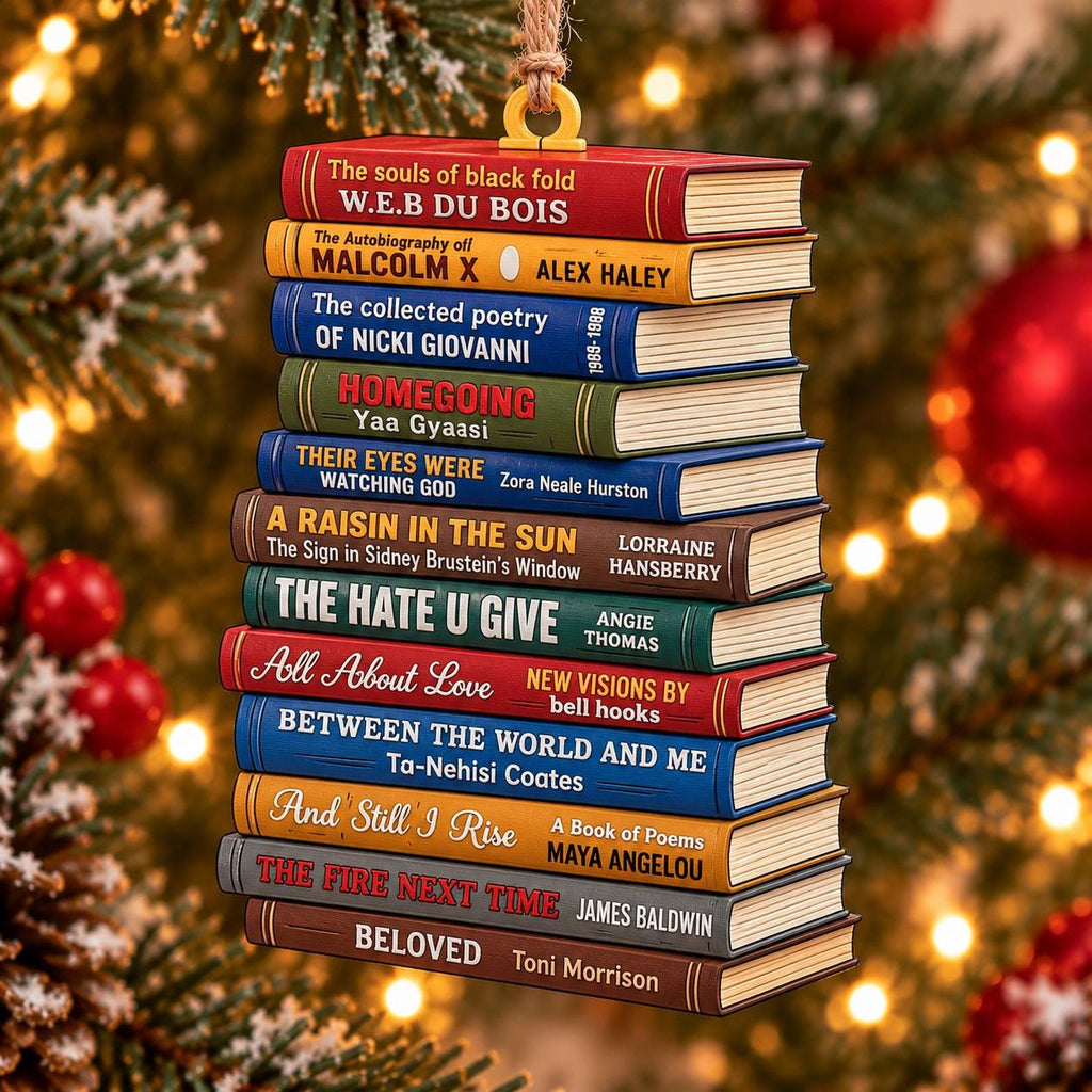 May include: A hanging Christmas tree ornament shaped like a stack of twelve colorful books. The spines feature titles and authors including W.E.B. Du Bois, Malcolm X, Nicki Giovanni, Yaa Gyaasi, Zora Neale Hurston, Lorraine Hansberry, and Toni Morrison.