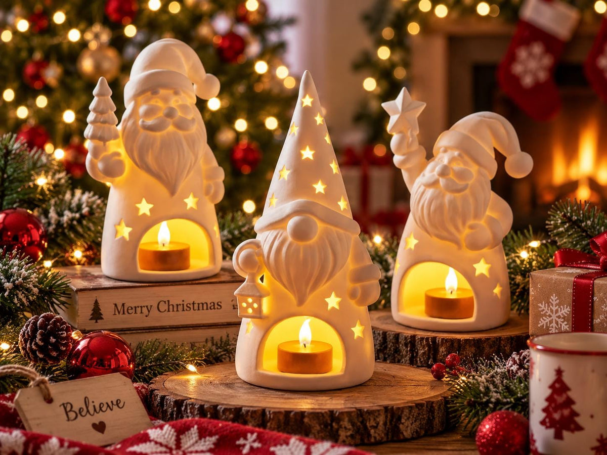 May include: Three white ceramic holiday figurines featuring two Santa Clauses and one gnome, each with a hollow base containing a lit tea light candle. The figures have star-shaped cutouts that emit light, and the center gnome wears a tall hat.
