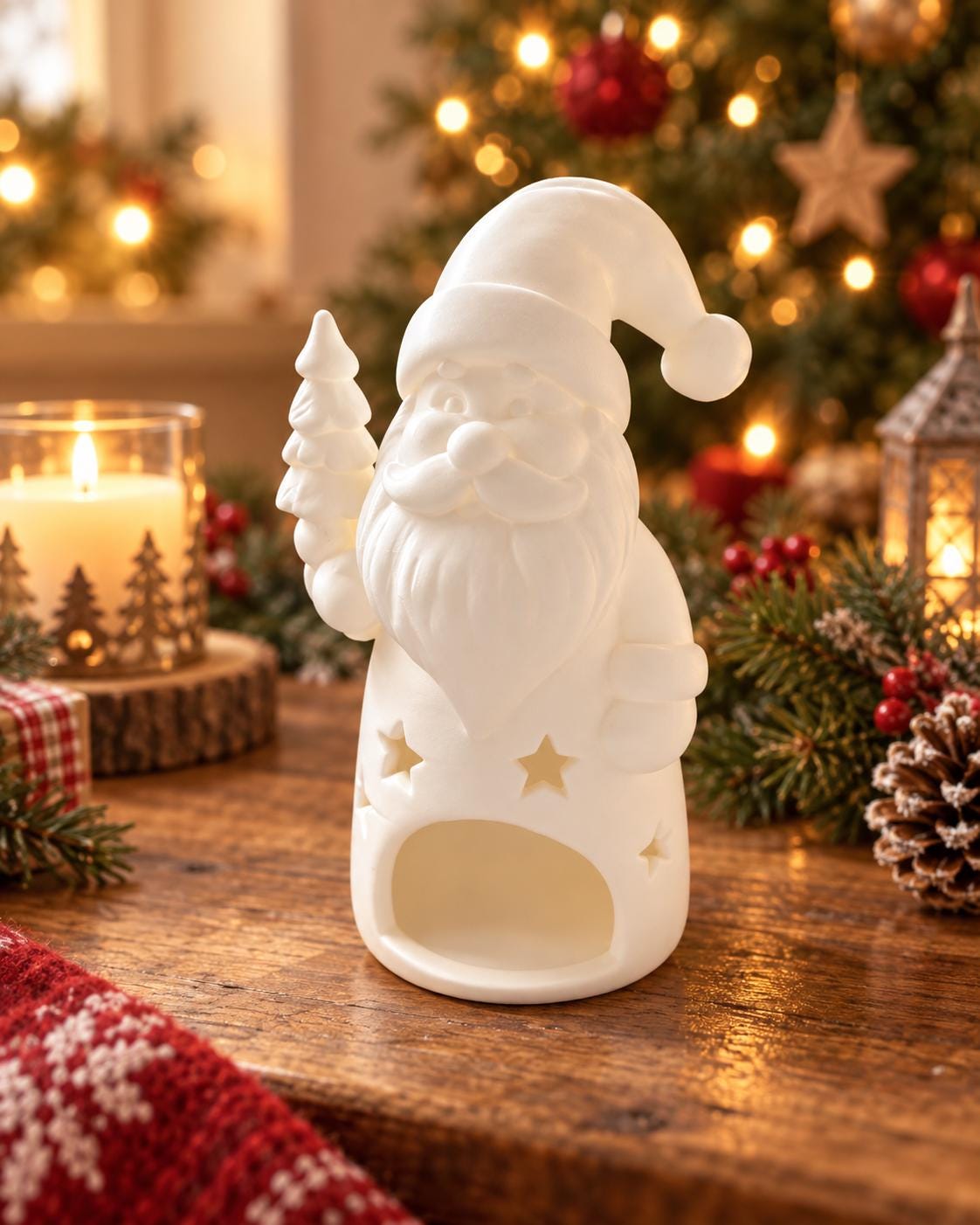 May include: A matte white ceramic Santa Claus figurine featuring a hollow base, a cutout star pattern around the midsection, and a small tree held in one hand. The figure has a rounded hat, a full beard, and a smooth, unpainted surface finish.