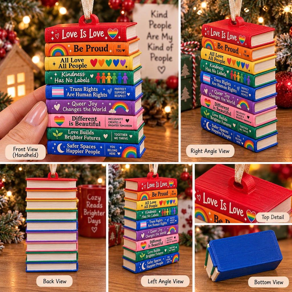 May include: A stack of nine miniature books serving as a hanging ornament. Each book spine features a different color and text, including phrases like Love Is Love, Be Proud, All Love All People, Kindness Has No Labels, and Trans Rights Are Human Rights.