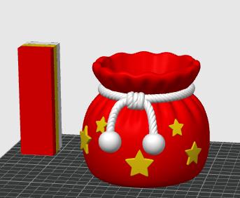 May include: A red, rounded pouch-shaped container featuring a white rope drawstring with two white spherical ends. The exterior is decorated with multiple yellow five-pointed stars. A tall, rectangular red, yellow, and white block stands nearby.