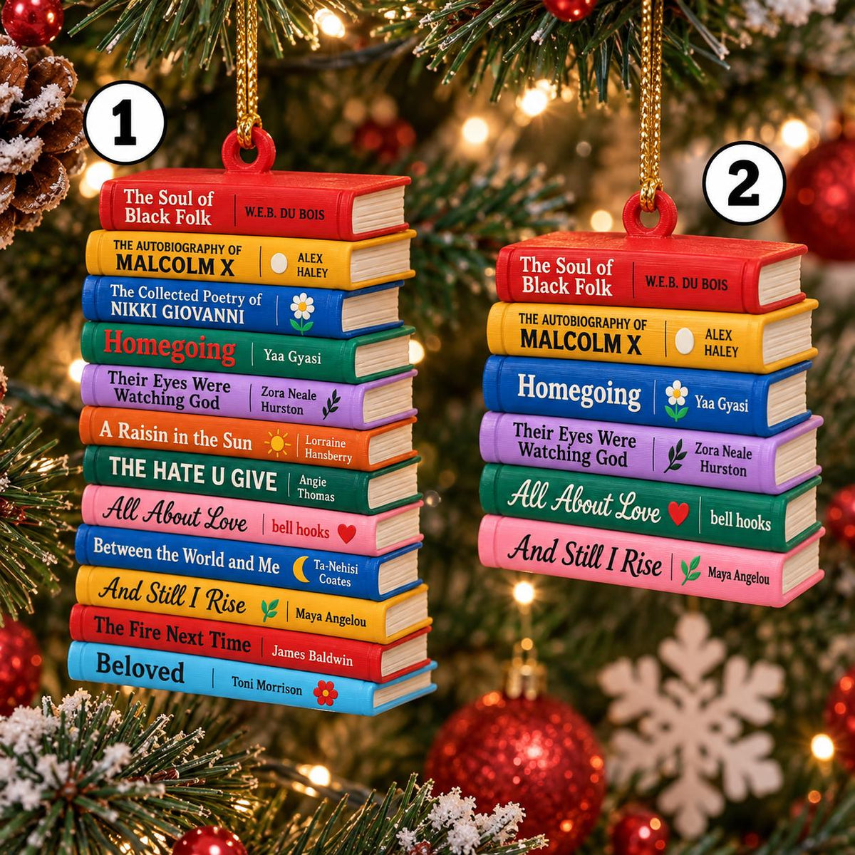 May include: Two hanging ornaments shaped like stacks of books. The larger stack features titles including The Soul of Black Folk, Malcolm X, and Beloved. The smaller stack includes The Soul of Black Folk, Malcolm X, and And Still I Rise.