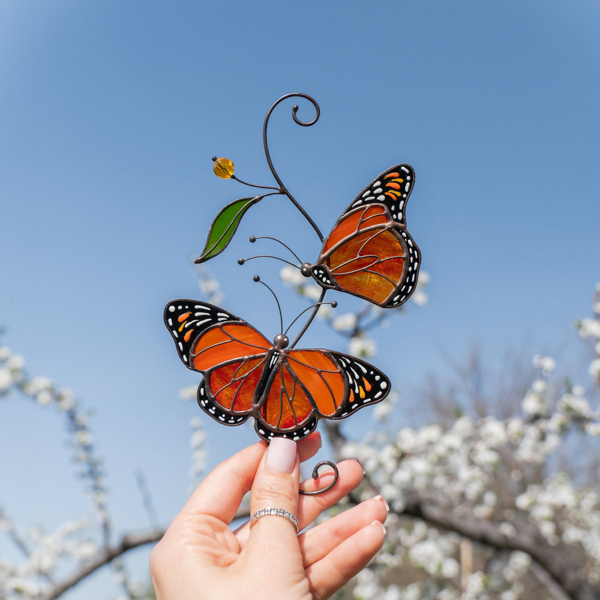 custom stained glass suncatcher of monarchs