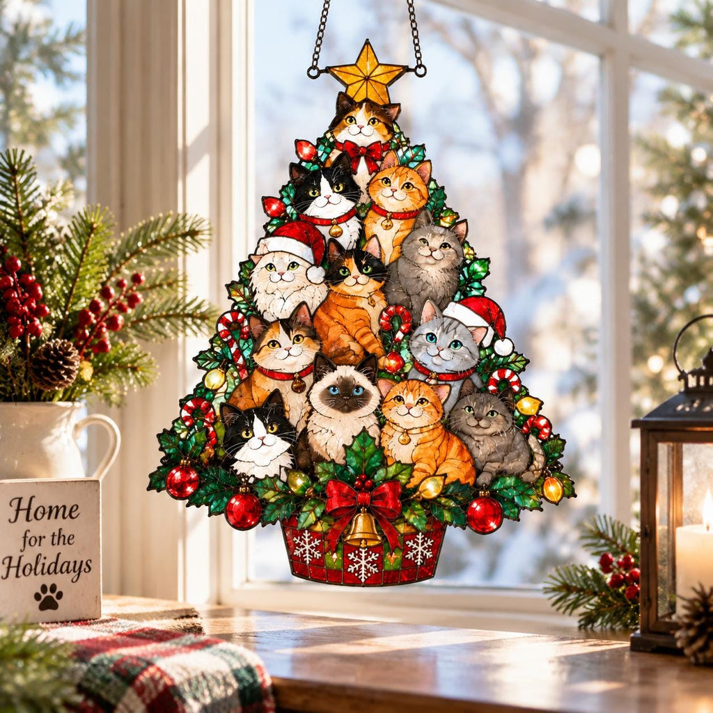 May include: A stained glass-style hanging ornament shaped like a Christmas tree, featuring multiple cats of various breeds and colors nestled among green foliage, red ornaments, candy canes, and a yellow star topper, finished with a red bow and bell.