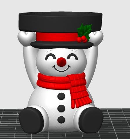 May include: A white snowman figurine with a red scarf, black buttons, and a red nose. The snowman holds a black top hat above its head, which is decorated with a red ribbon and green holly leaves with red berries. The snowman has a smiling face.