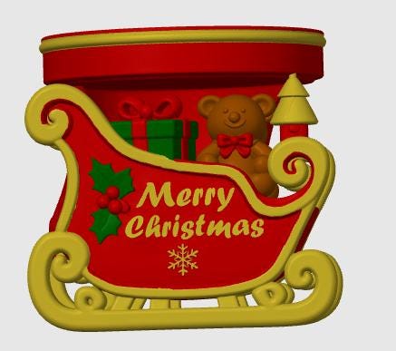 May include: A red and gold decorative sleigh ornament featuring the text Merry Christmas in gold lettering. The sleigh contains a brown teddy bear with a red bow, a green gift box with a red ribbon, and a small tree. Green holly leaves and red berries are on the side.