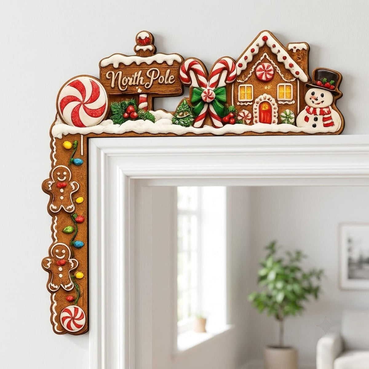 Holiday corner frame decoration wrapping around the top of a white doorway, showcasing layered gingerbread cookies, colorful Christmas lights, snowy accents, and classic North Pole village details.
