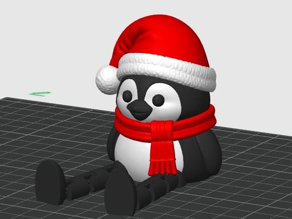 May include: A 3D rendered penguin figurine featuring a black and white body, wearing a bright red Santa hat with a white pom-pom and trim, and a matching red scarf. The penguin is in a seated position with extended black legs.