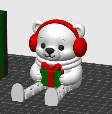 May include: A white bear figurine with a smooth finish, wearing bright red earmuffs and a white scarf. The bear is in a seated position, holding a small green gift box wrapped with a red ribbon and a bow. The figure has black eyes and a nose.
