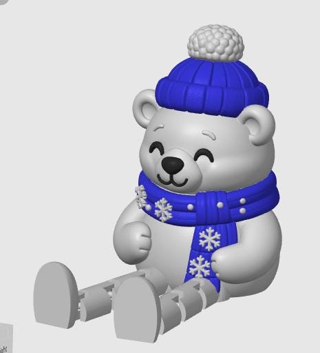May include: A white polar bear figurine with a smooth finish, wearing a bright blue knit-style hat with a textured pom-pom and a matching blue scarf decorated with white snowflake patterns. The bear has a smiling face and articulated legs.