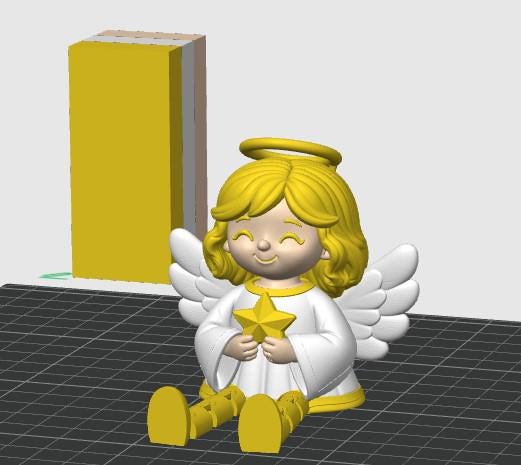 May include: A 3D rendered figurine of a seated angel with yellow hair, a yellow halo, and white wings. The angel wears a white robe with yellow trim, holds a yellow star in its hands, and has yellow shoes. A yellow rectangular block stands behind.