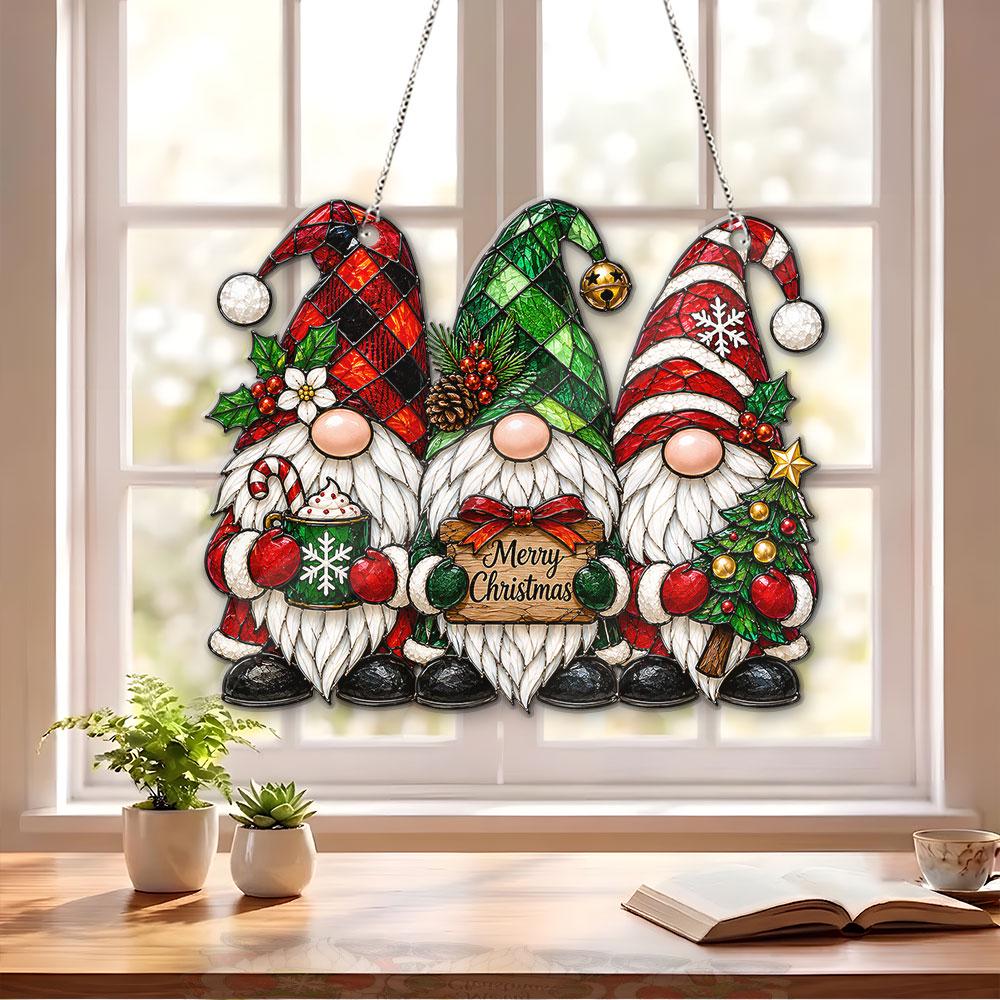 May include: A hanging decoration featuring three gnomes with white beards and colorful hats. The left gnome holds a mug, the center gnome holds a sign reading Merry Christmas, and the right gnome holds a decorated Christmas tree.