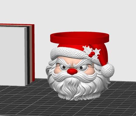 May include: A 3D-rendered Santa Claus head planter featuring a red hat with a white textured brim, a red pom-pom, and a holly leaf accent. The Santa figure has a thick white beard, a red nose, and an angry facial expression with furrowed brows.