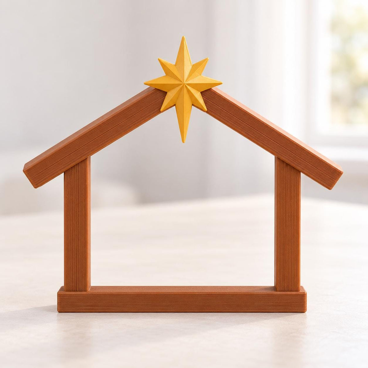 May include: A brown, house-shaped nativity stable frame with a textured, wood-like finish. A bright yellow, eight-pointed star is mounted at the peak of the roof, centered where the two roof beams meet to form a triangular gable structure.
