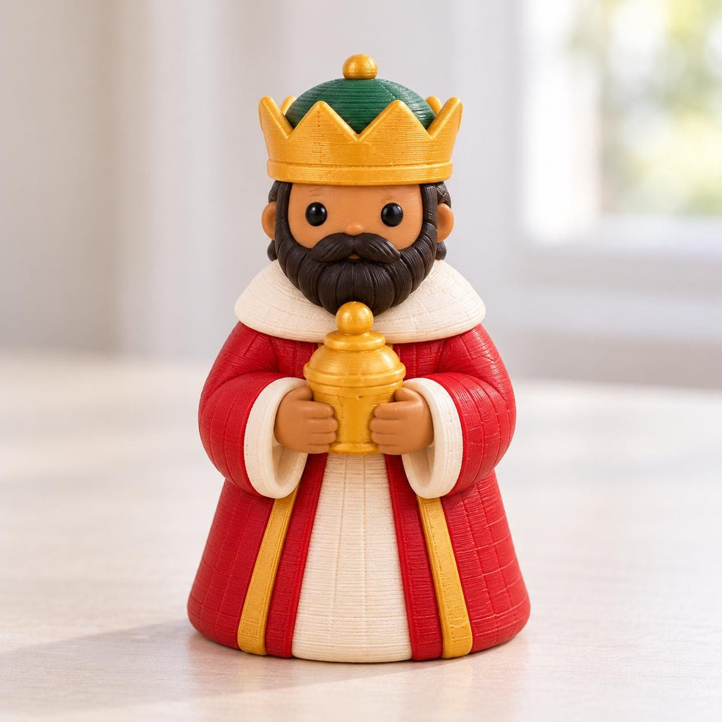 May include: A figurine of a king with a dark brown beard, wearing a yellow crown, a red robe with white trim, and a white tunic. The king holds a small, golden, lidded vessel in both hands. The figure has a smooth, matte finish.