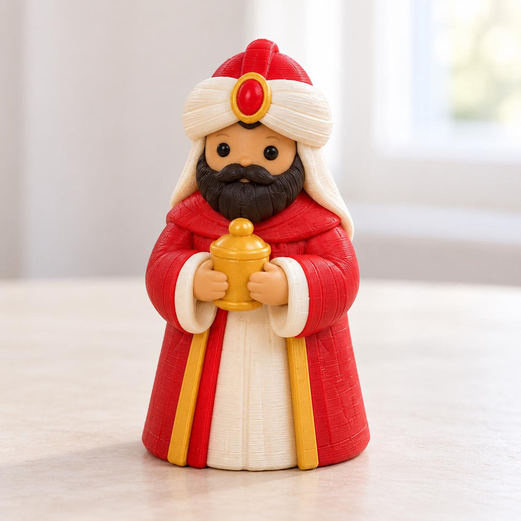 May include: A figurine of a bearded figure wearing a red robe with white and gold trim, a white turban with a red and gold center jewel, and holding a small gold-colored container. The figure has a black beard and mustache.