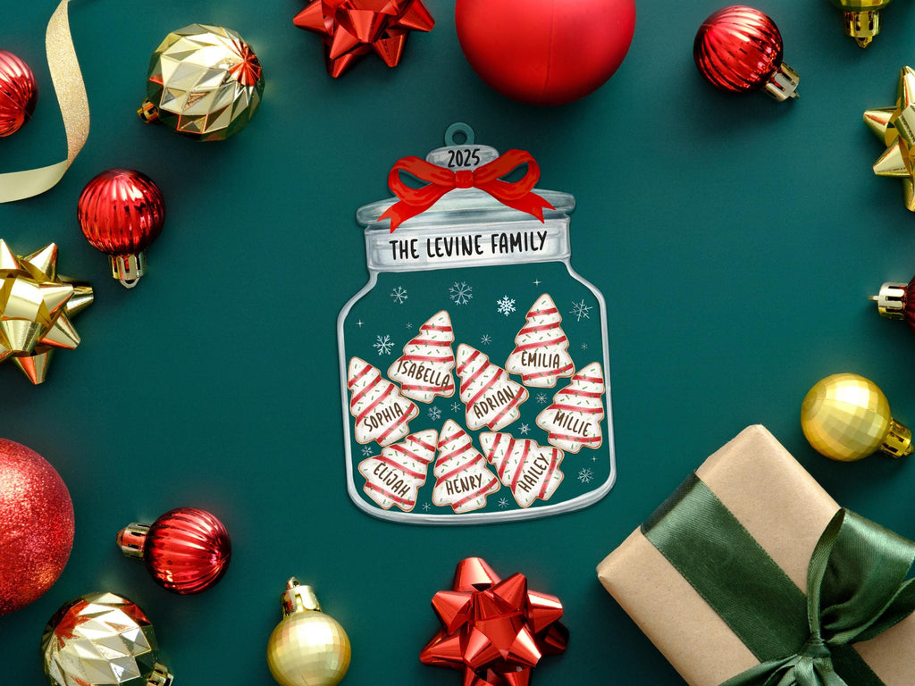 May include: A flat, jar-shaped Christmas ornament featuring a red bow at the top, the text "THE LEVINE FAMILY" and "2025", and a collection of white and red striped tree-shaped cookies, each personalized with names including Isabella, Emilia, and Adrian.