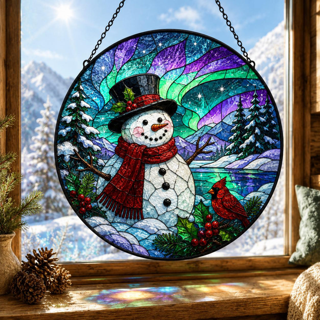 Christmas snowman stained glass style suncatcher with red cardinals, aurora sky and snowy pine forest hanging in a sunny window