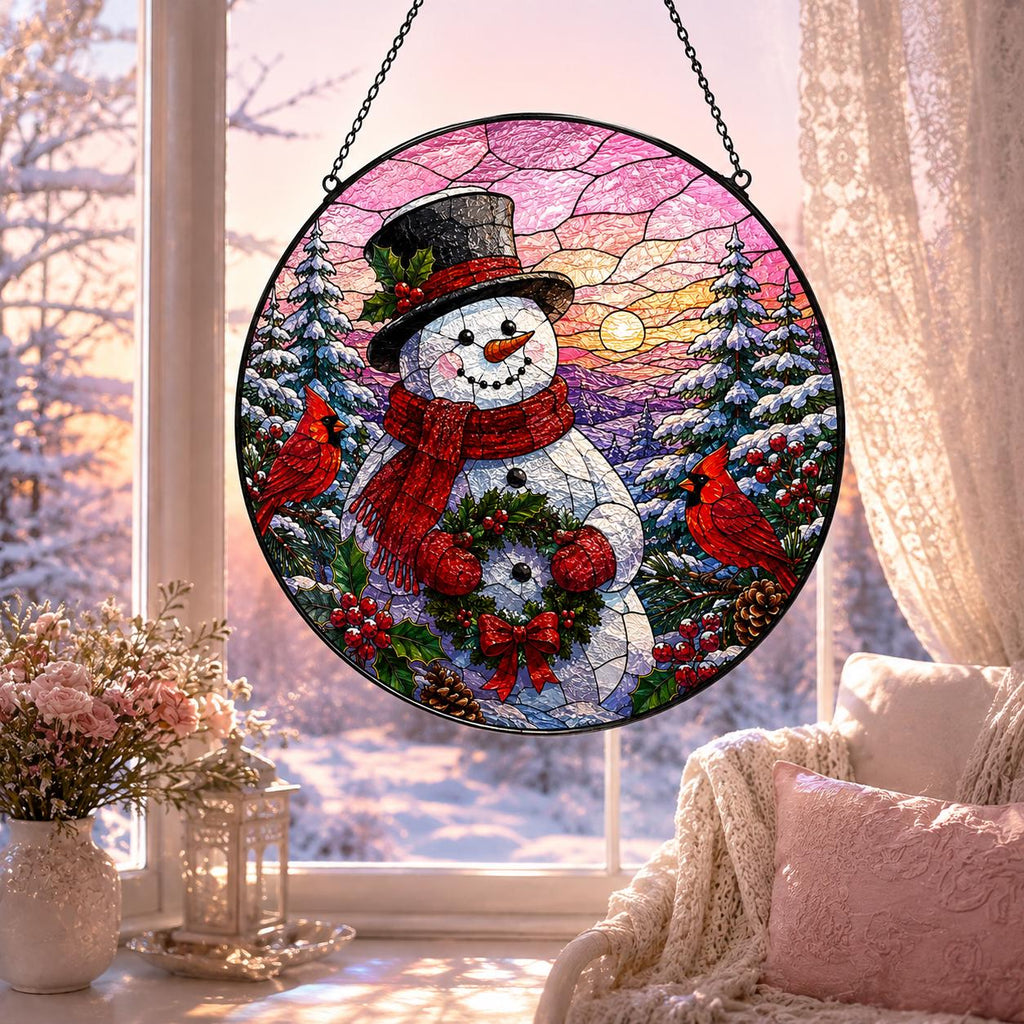 Pink winter sunset snowman suncatcher with two red cardinals, snowy pine trees, holly berries and Christmas wreath