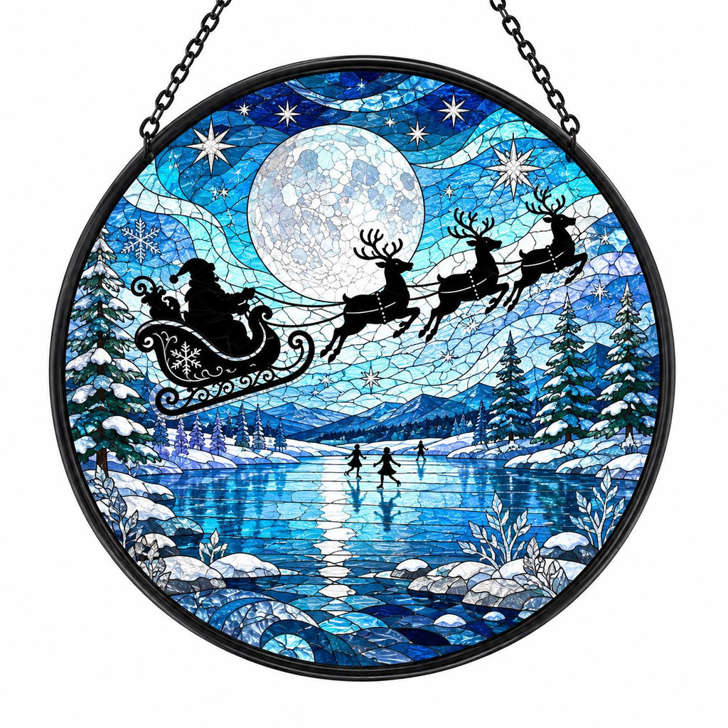 Blue winter stained glass suncatcher featuring Santa sleigh and reindeer beneath a full moon over an icy lake, snowy forest, and mountain landscape.