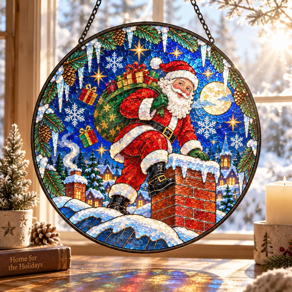 Santa Claus climbing a snowy chimney on a blue Christmas suncatcher with moon, stars and festive village scenery