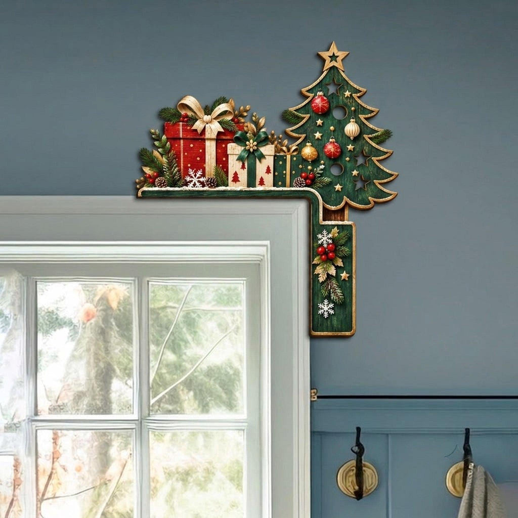May include: A decorative L-shaped Christmas door corner sign featuring a green pine tree adorned with red and gold ornaments, stars, and snowflakes. Beside the tree are stacked red and white gift boxes with bows, accented by pine branches and berries.