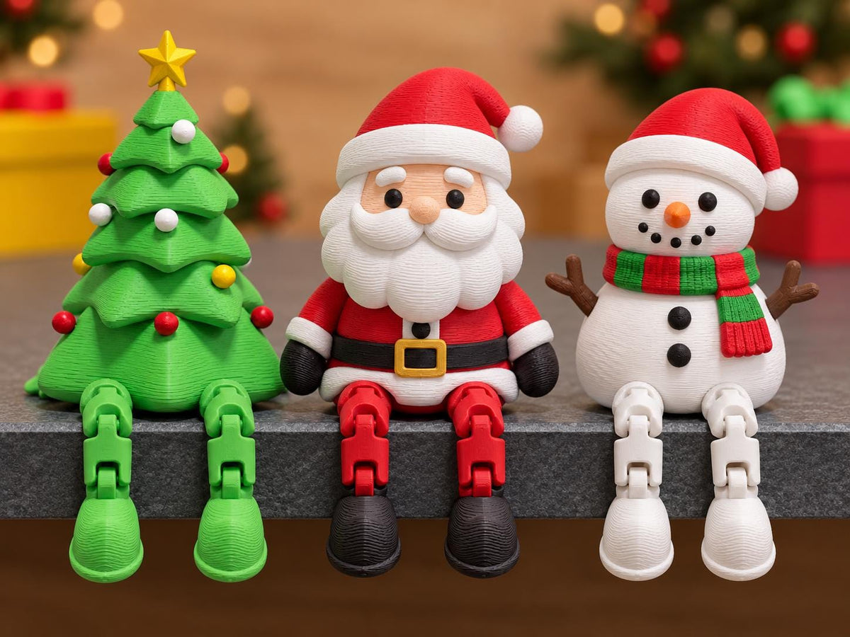 May include: Three articulated figurines featuring a green Christmas tree with a yellow star, a Santa Claus in a red suit with a white beard, and a white snowman wearing a red hat and a green and red striped scarf, all with dangling legs.