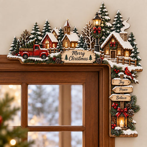 May include: A decorative wooden door corner sign featuring a snowy Christmas village scene with a red truck, pine trees, and a streetlamp. A sign reads Merry Christmas, while three hanging wooden arrows display the words Joy, Peace, and Believe.