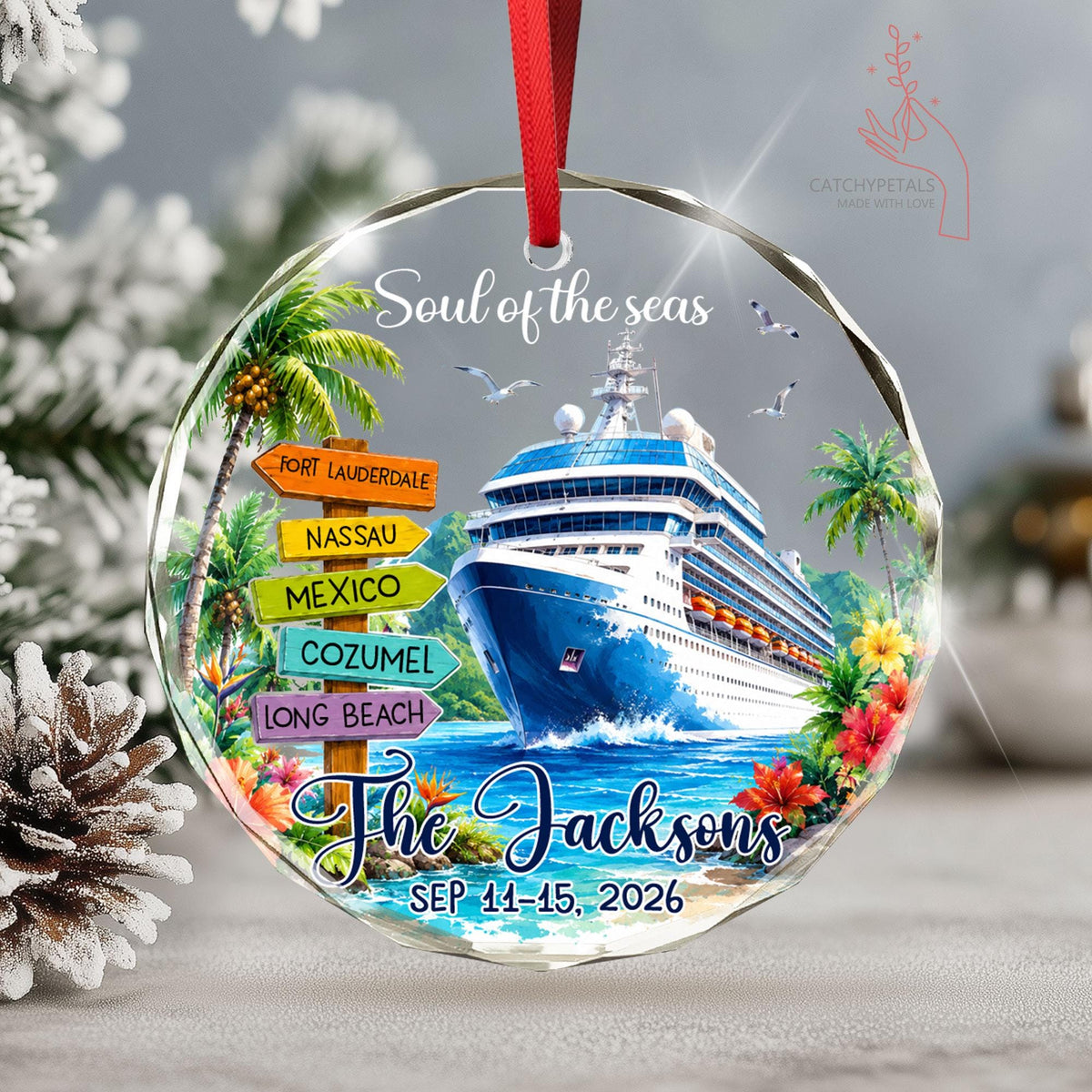May include: A round glass ornament with a red ribbon featuring a cruise ship, tropical palm trees, and a wooden signpost with the text Fort Lauderdale, Nassau, Mexico, Cozumel, Long Beach. It includes the text Soul of the seas, The Jacksons, and SEP 11-15, 2026.
