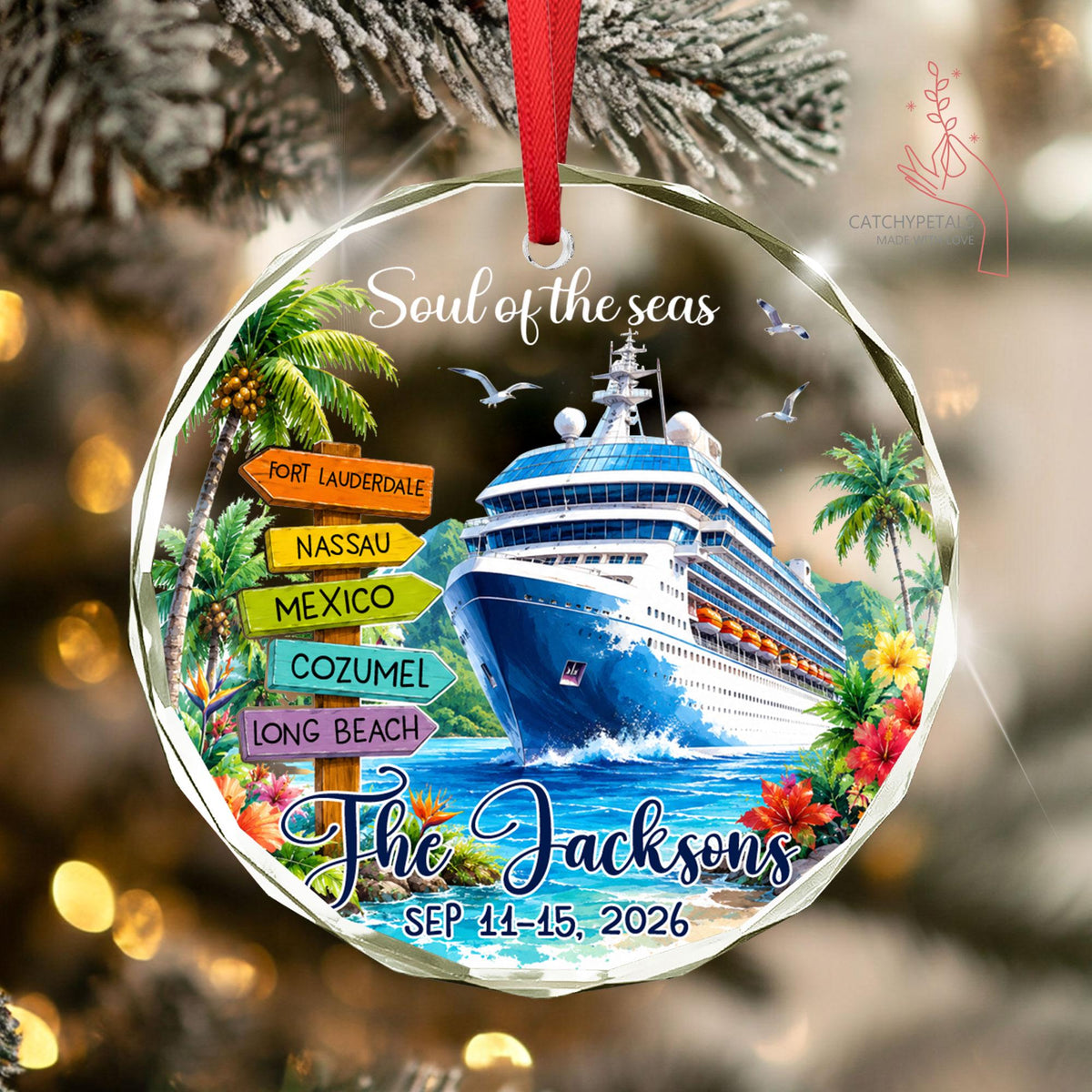 May include: A round glass ornament with a red ribbon featuring a cruise ship on blue water, palm trees, and a wooden signpost with the text Fort Lauderdale, Nassau, Mexico, Cozumel, Long Beach. It includes the text Soul of the seas, The Jacksons, and SEP 11-15, 2026.