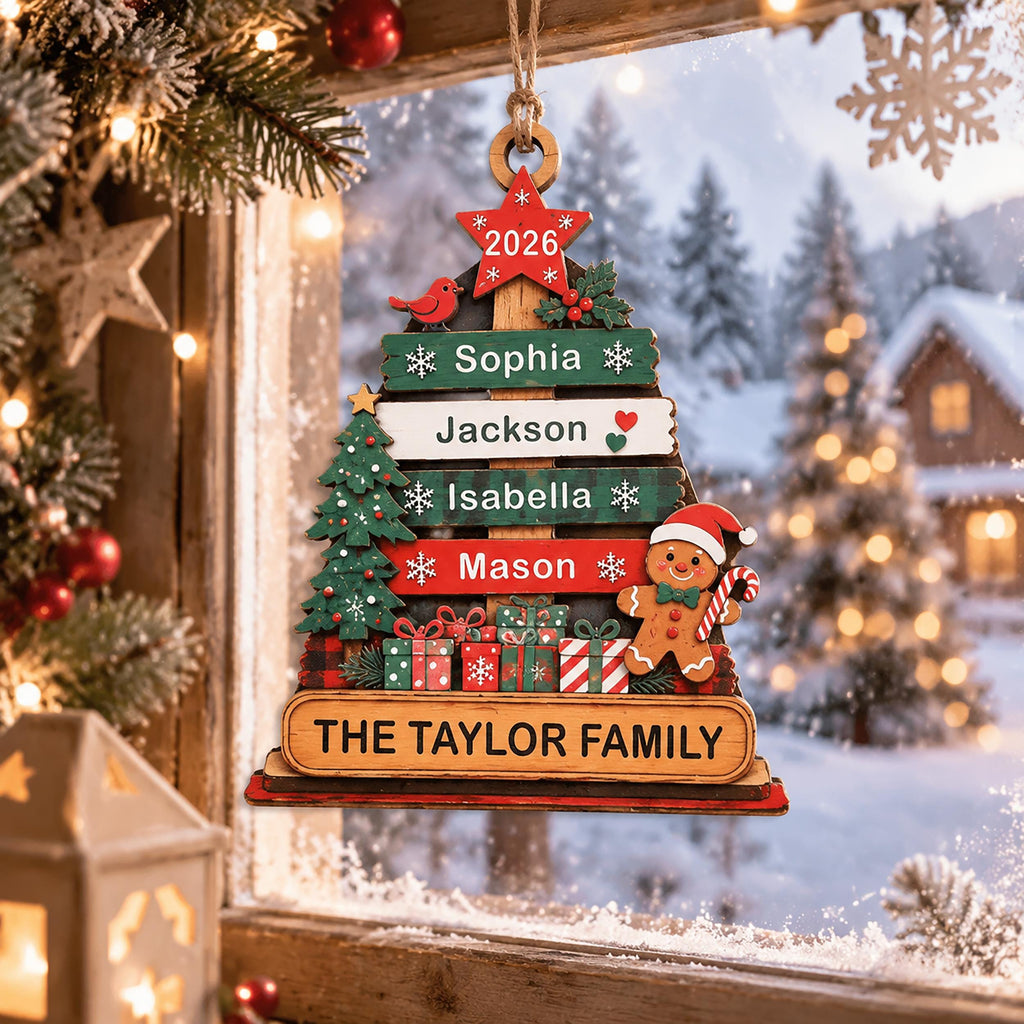 May include: A wooden Christmas tree ornament featuring a red star at the top with the year 2026, four horizontal planks with the names Sophia, Jackson, Isabella, and Mason, a gingerbread man, a small tree, gifts, and the text THE TAYLOR FAMILY.