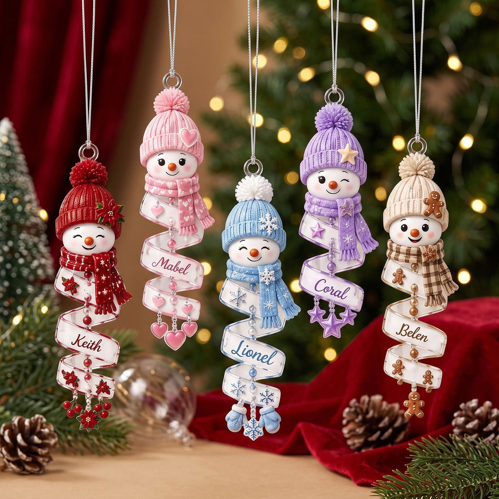 May include: Five hanging snowman ornaments with knit hats and scarves in red, pink, blue, purple, and beige. Each snowman features a spiraling white ribbon printed with the names Keith, Mabel, Lionel, Coral, and Belen, accented with beads and charms.