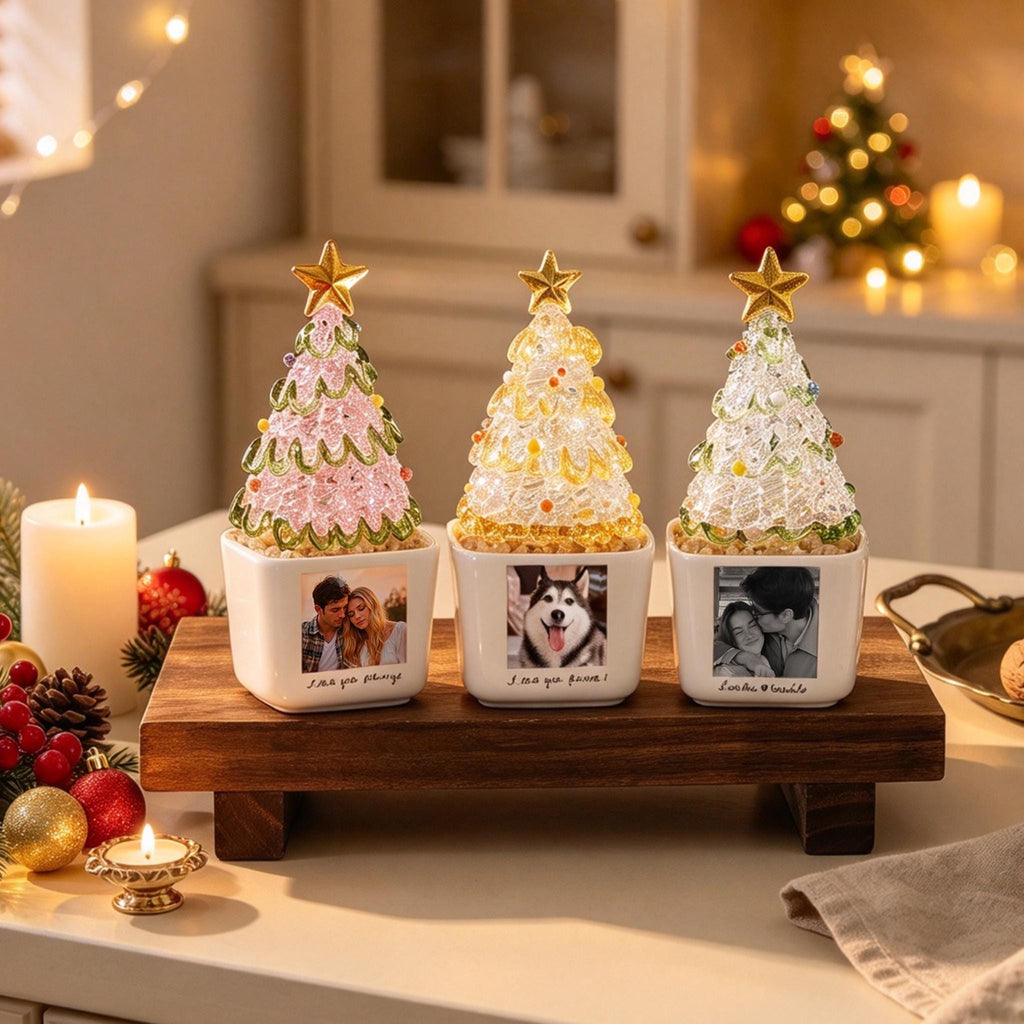May include: Three decorative tabletop Christmas trees with translucent, textured, crystalline-style branches in pink, yellow, and clear, each topped with a gold star. The trees are set in square white ceramic pots, each featuring a custom photo print.