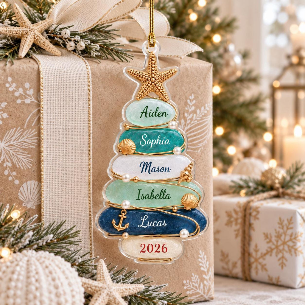 May include: A clear, tree-shaped Christmas ornament featuring five horizontal layers in shades of light green, teal, white, and dark blue. Each layer is inscribed with the names Aiden, Sophia, Mason, Isabella, and Lucas, with 2026 at the base.