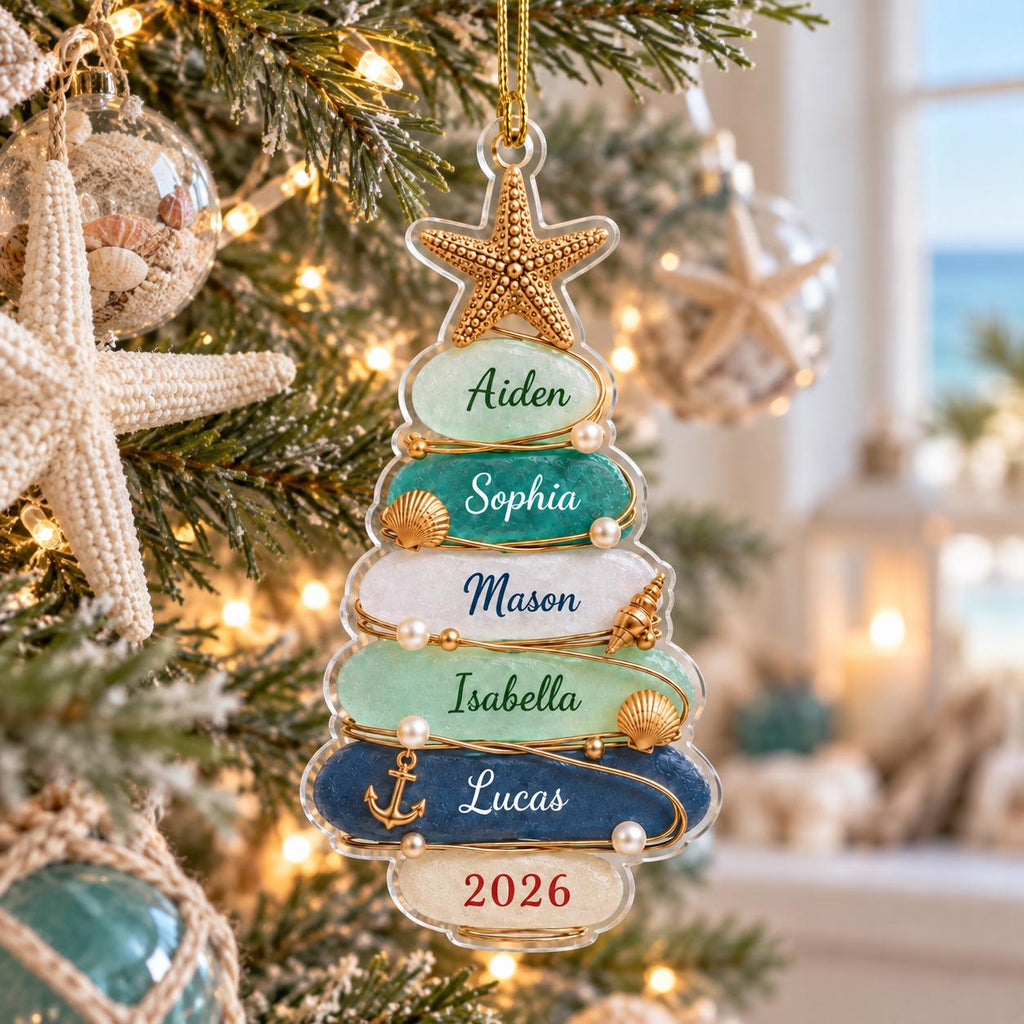 May include: A clear, tree-shaped Christmas ornament featuring five horizontal layers in shades of light green, teal, white, mint, and navy blue. Each layer displays a name: Aiden, Sophia, Mason, Isabella, and Lucas, with 2026 at the base.