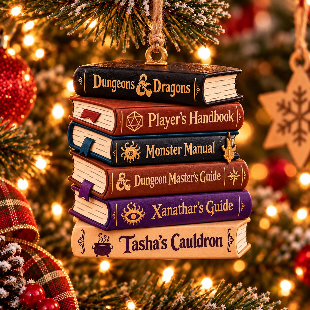 May include: A hanging Christmas tree ornament featuring a stack of six miniature books with titles Dungeons & Dragons, Player's Handbook, Monster Manual, Dungeon Master's Guide, Xanathar's Guide, and Tasha's Cauldron, suspended by a gold metal loop.