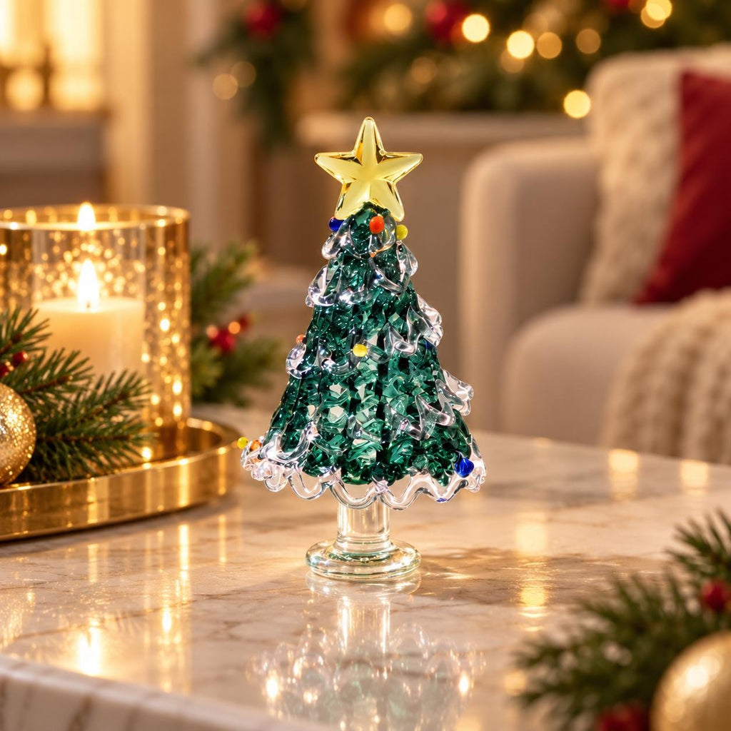 May include: A decorative glass Christmas tree figurine featuring a deep green textured body, a clear glass pedestal base, and a bright yellow star topper. The tree is adorned with small, colorful glass spheres scattered throughout the branches.