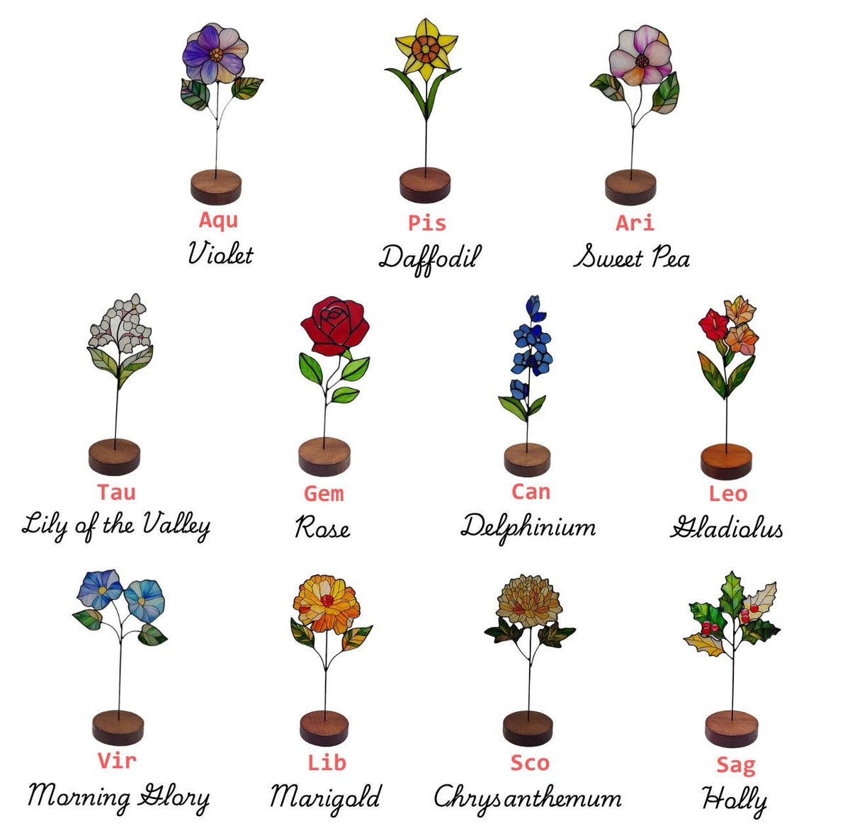 May include: A collection of twelve stained glass flowers on thin metal stems with circular wooden bases. Each flower represents a birth month or zodiac sign, labeled with text including Violet, Daffodil, Sweet Pea, Lily of the Valley, Rose, Delphinium, Gladiolus, Morning Glory, Marigold, Chrysanthemum, and Holly.
