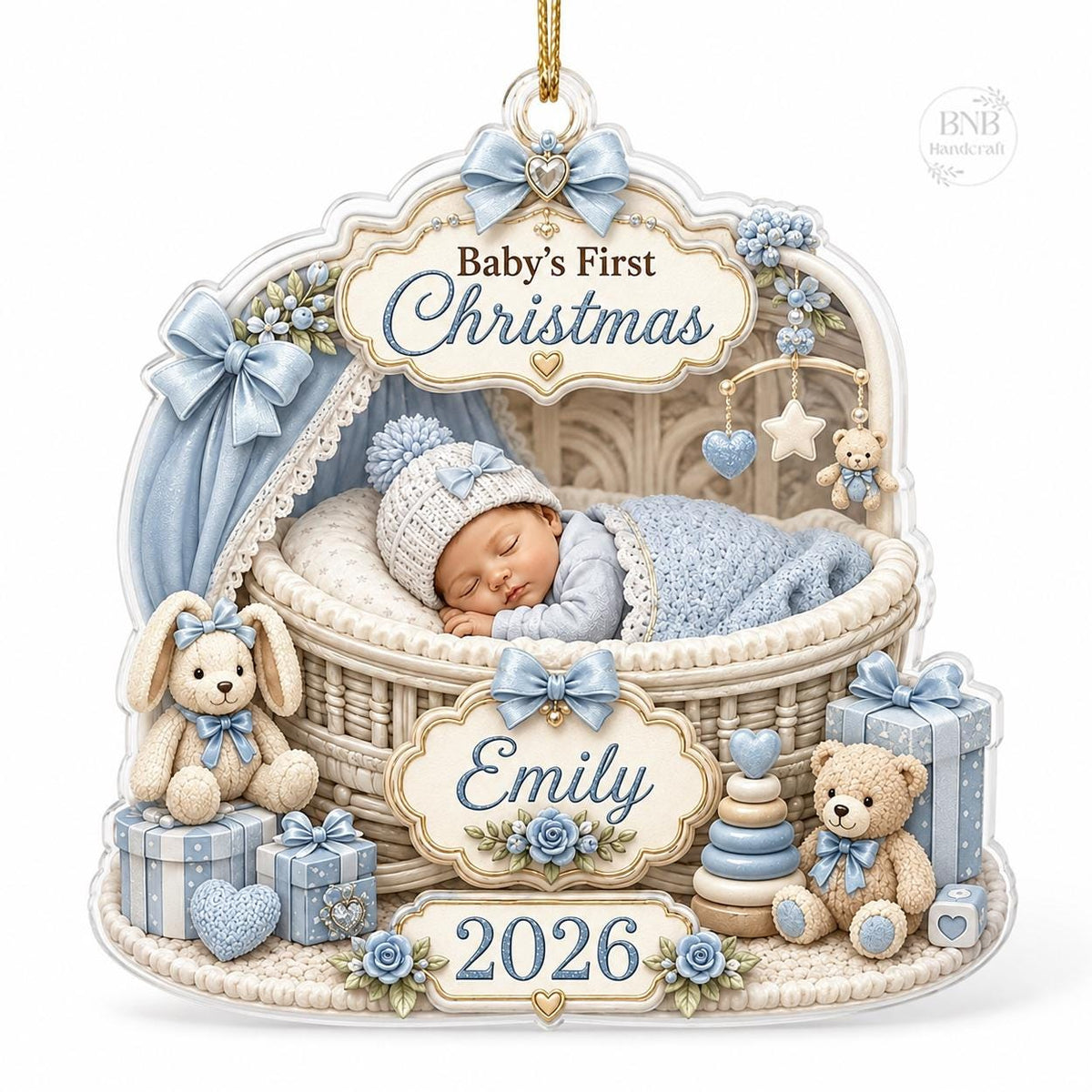 May include: A decorative ornament featuring a sleeping baby in a wicker bassinet with blue accents. The text reads Baby's First Christmas, Emily, and 2026. It includes a plush bunny, a teddy bear, gift boxes, and a mobile with stars and hearts.