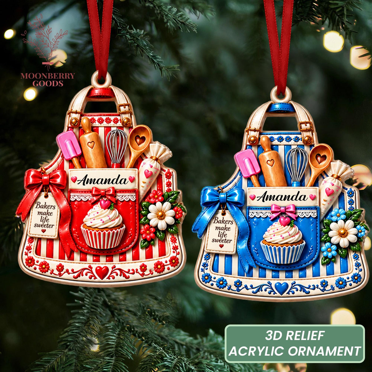 May include: Two 3D relief acrylic ornaments shaped like aprons, one red and white, one blue and white. Each features a rolling pin, whisk, spatula, piping bag, cupcake, flowers, a bow, and a tag reading "Bakers make life sweeter" with the name "Amanda".