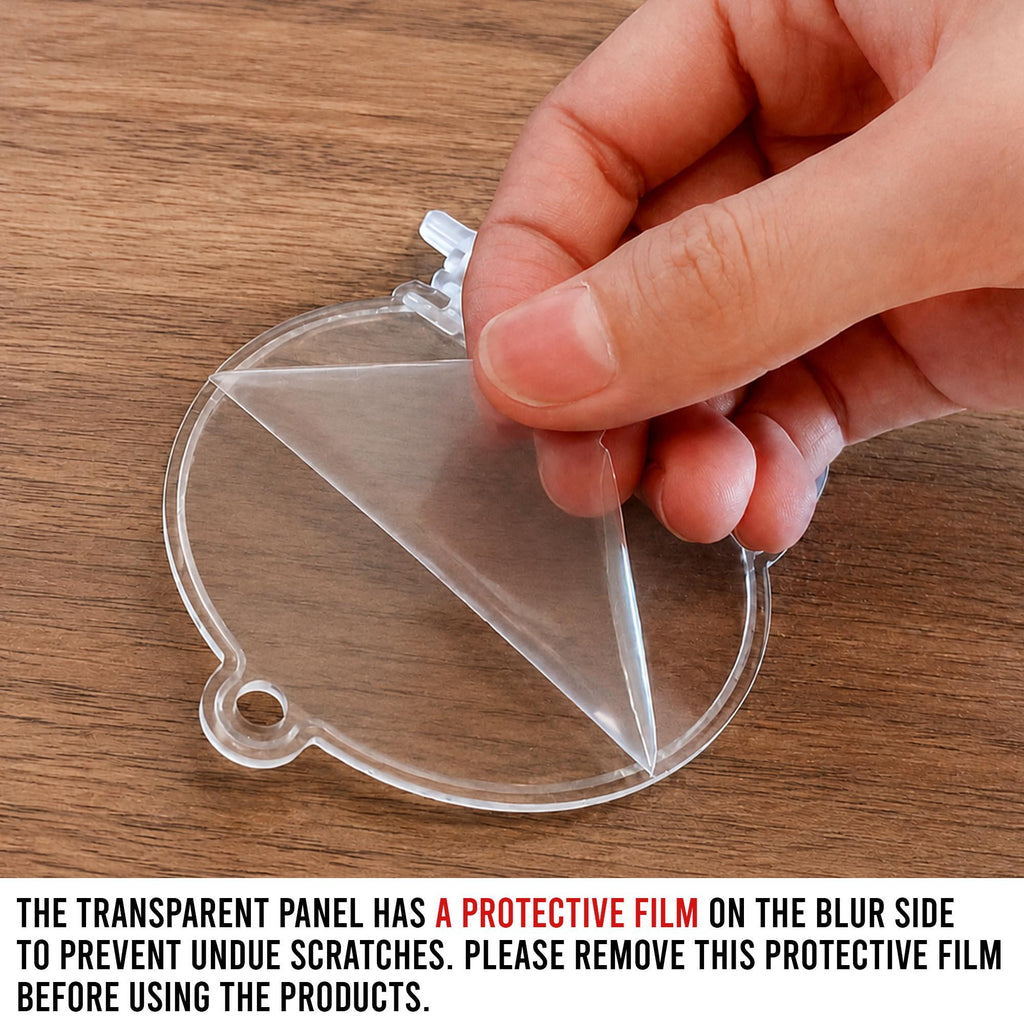 May include: A circular transparent acrylic ornament blank featuring a small hanging loop at the top. A thin, clear protective film is being partially peeled away from the surface. The text states: The transparent panel has a protective film on the blur side to prevent undue scratches. Please remove this protective film before using the products.