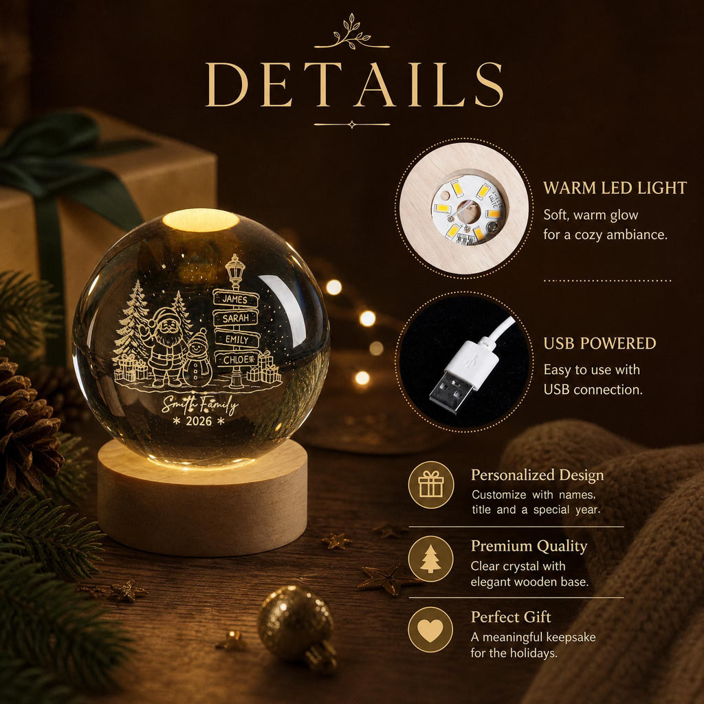 May include: A clear crystal sphere lamp on a round wooden base, featuring an engraved design of Santa Claus, a snowman, pine trees, and a street sign with the names James, Sarah, Emily, and Chloe, plus the text Smith Family and 2026.