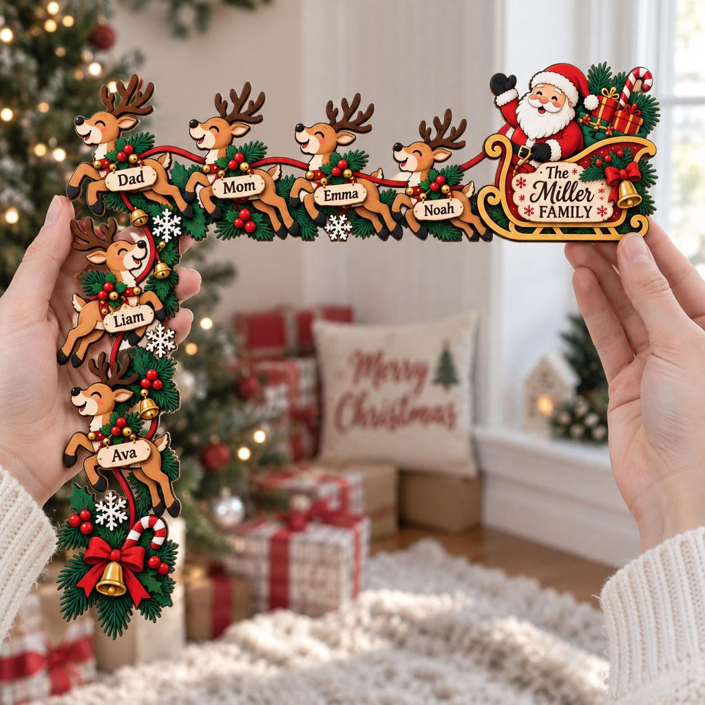 May include: A wooden L-shaped Christmas door corner decoration featuring Santa in a sleigh and six reindeer. Each reindeer has a name tag: Dad, Mom, Emma, Noah, Liam, and Ava. The sleigh is labeled The Miller Family, decorated with greenery, red berries, and bells.