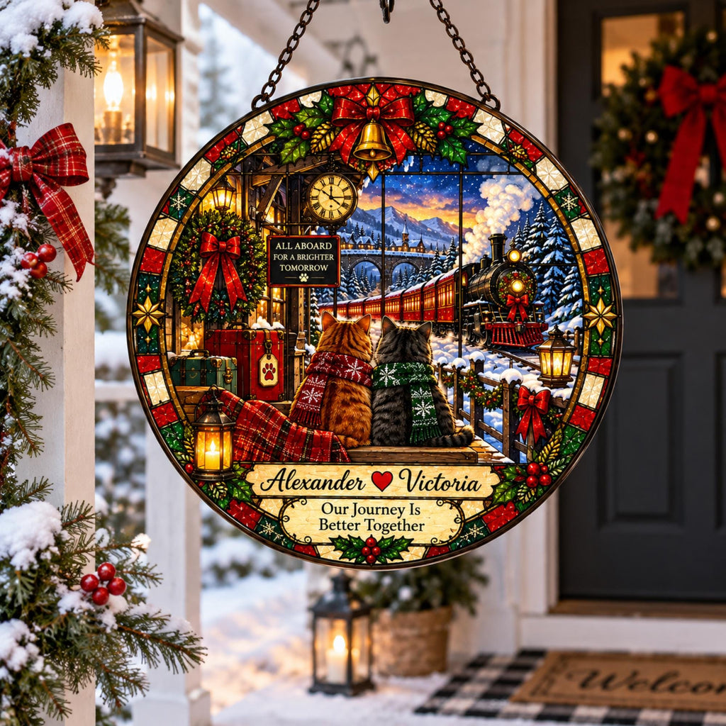 May include: A circular stained glass hanging decoration featuring two cats wearing scarves, watching a steam train in a snowy landscape. The design includes a clock, a red bow, and the text: All Aboard For A Brighter Tomorrow, Alexander, Victoria, Our Journey Is Better Together.