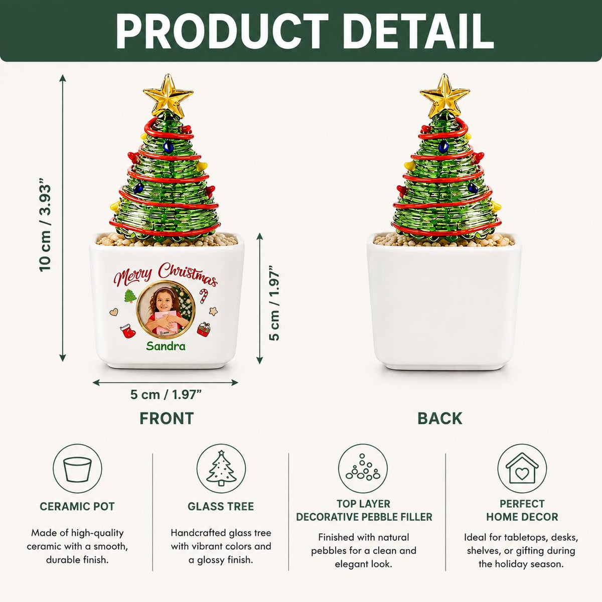 May include: A green wire-wrapped Christmas tree ornament with a gold star topper, set in a white ceramic pot filled with pebbles. The pot features the text Merry Christmas, a circular photo, and the name Sandra. It measures 3.93 inches by 1.97 inches.