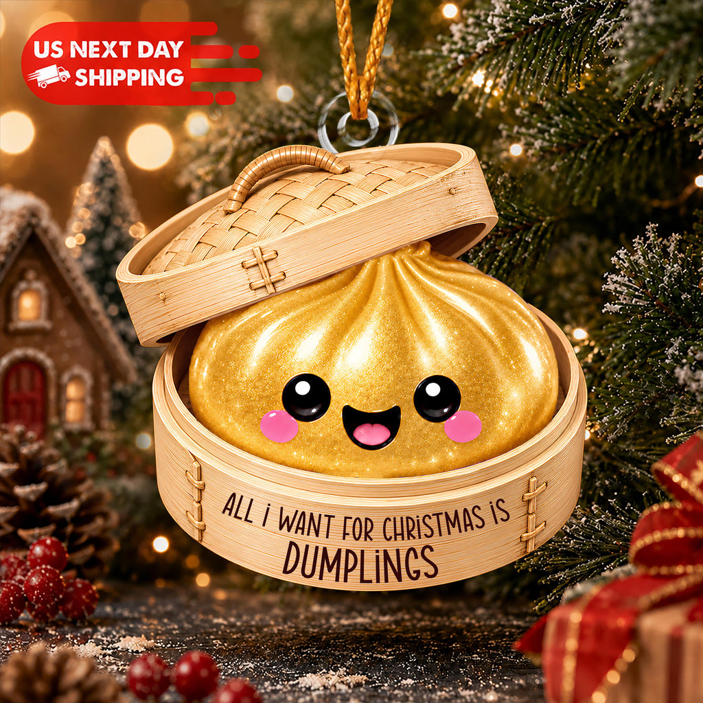 A golden dumpling ornament with a smiling face is hanging from a string, surrounded by a festive Christmas tree and decorations.