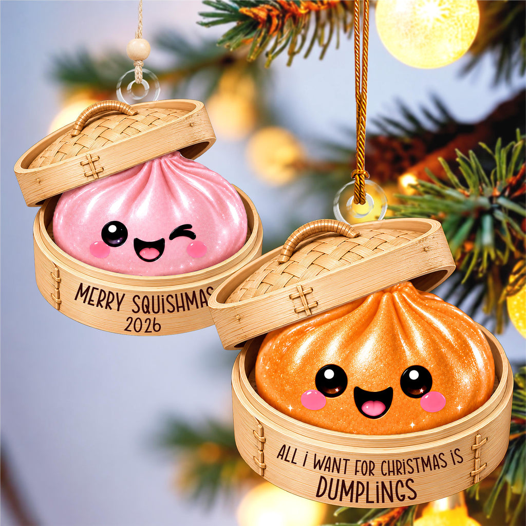 two wooden ornaments shaped like dumplings hanging on a Christmas tree. The ornaments have a cheerful and festive appearance, with the text "MERRY SQUISHMAS" and "ALL I WANT FOR CHRISTMAS IS DUMPLINGS" written on them.
