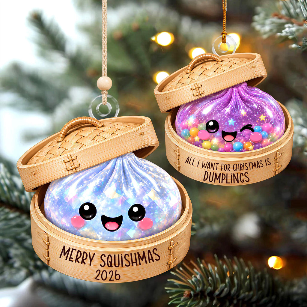 two ornaments hanging from a string, each shaped like a dumpling and decorated with a face. The ornaments are placed on a Christmas tree, creating a festive and whimsical scene.