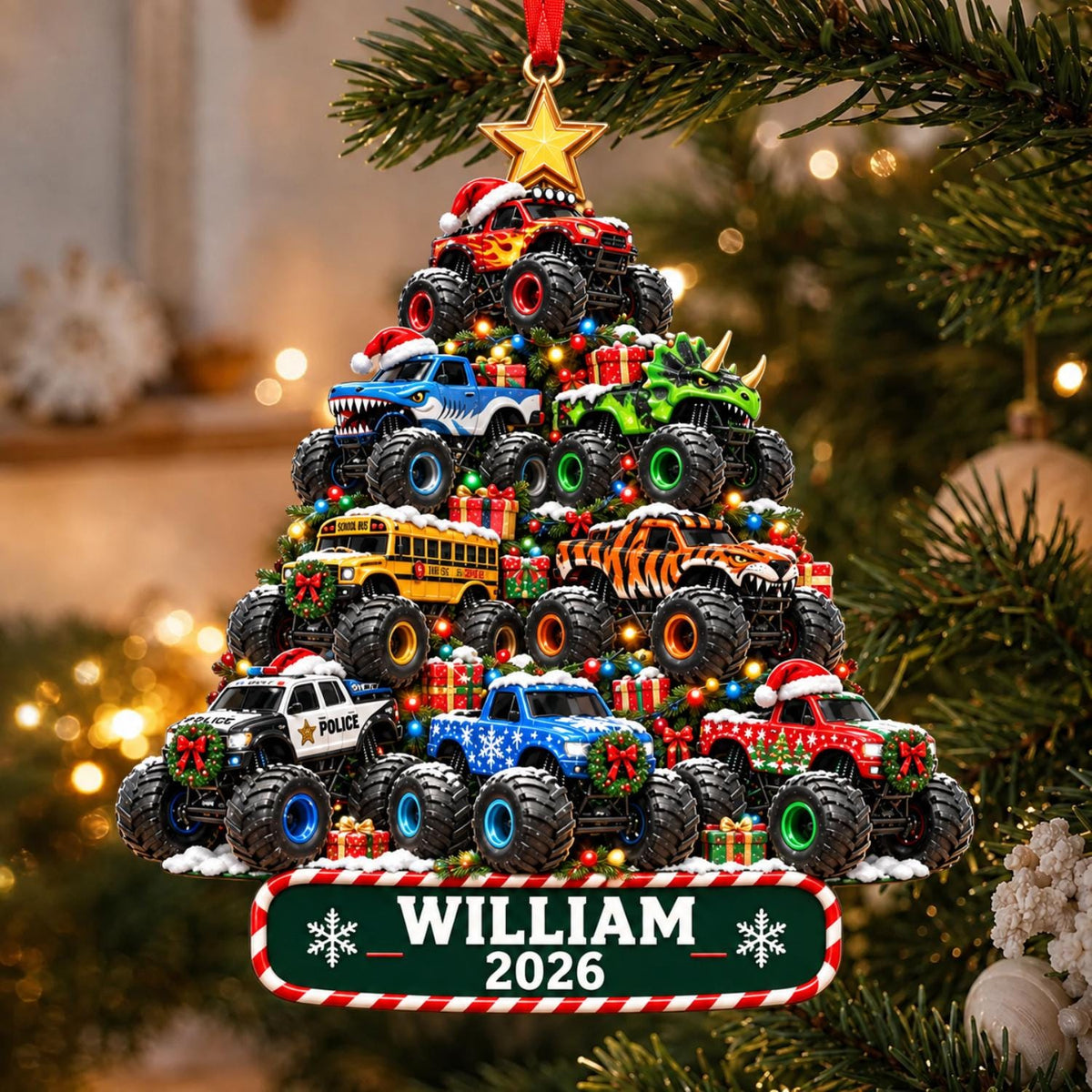 May include: A Christmas tree-shaped ornament featuring stacked monster trucks, including a police vehicle, a school bus, and a dinosaur-themed truck. The ornament is topped with a gold star and includes a green nameplate reading WILLIAM 2026.