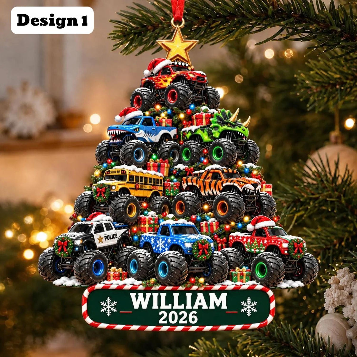 May include: A Christmas tree-shaped ornament featuring stacked monster trucks, a school bus, and small gift boxes. The ornament is topped with a gold star and features a green base plate with the text WILLIAM 2026 and snowflake graphics.